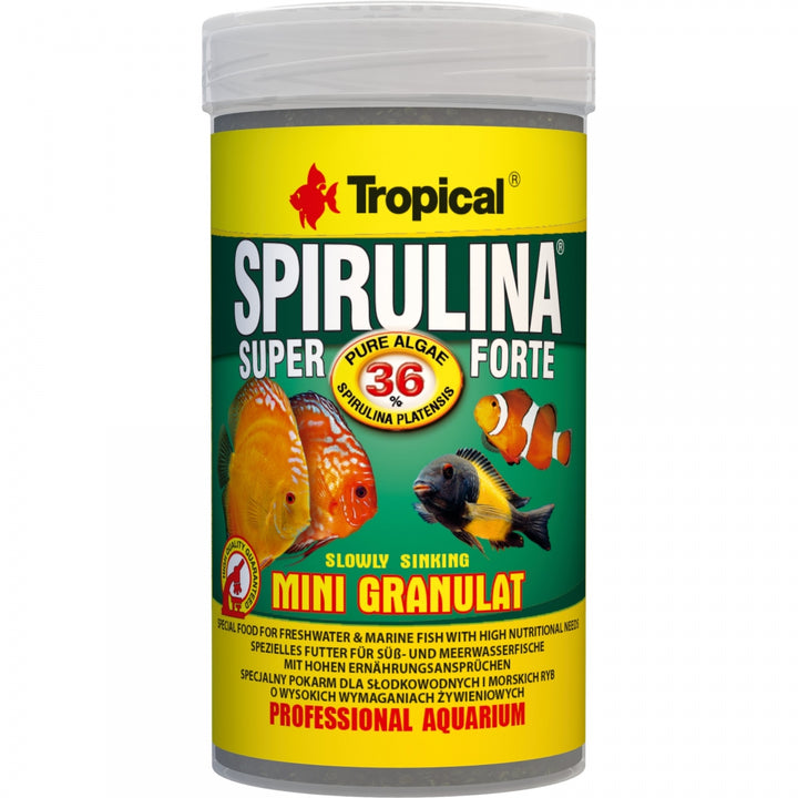 A white plastic bottle of Tropical Spirulina Super Forte slow sinking mini granulate fish food, featuring a green and yellow label with images of colorful aquarium fish.