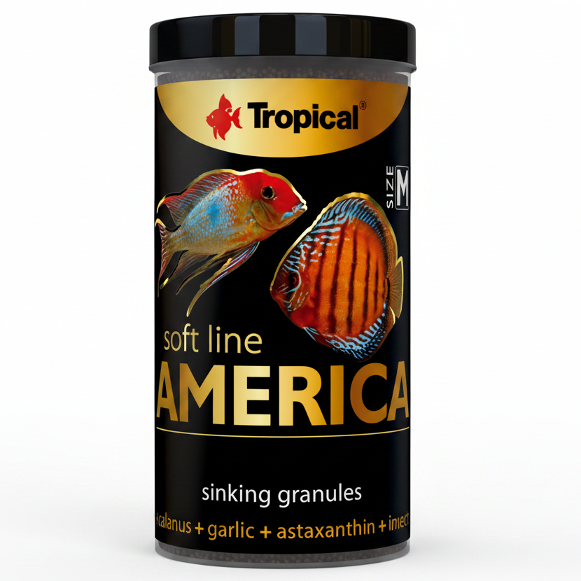 A cylindrical black container of Tropical Soft Line America sinking granules fish food, featuring colorful discus fish illustrations on a black label with gold text.