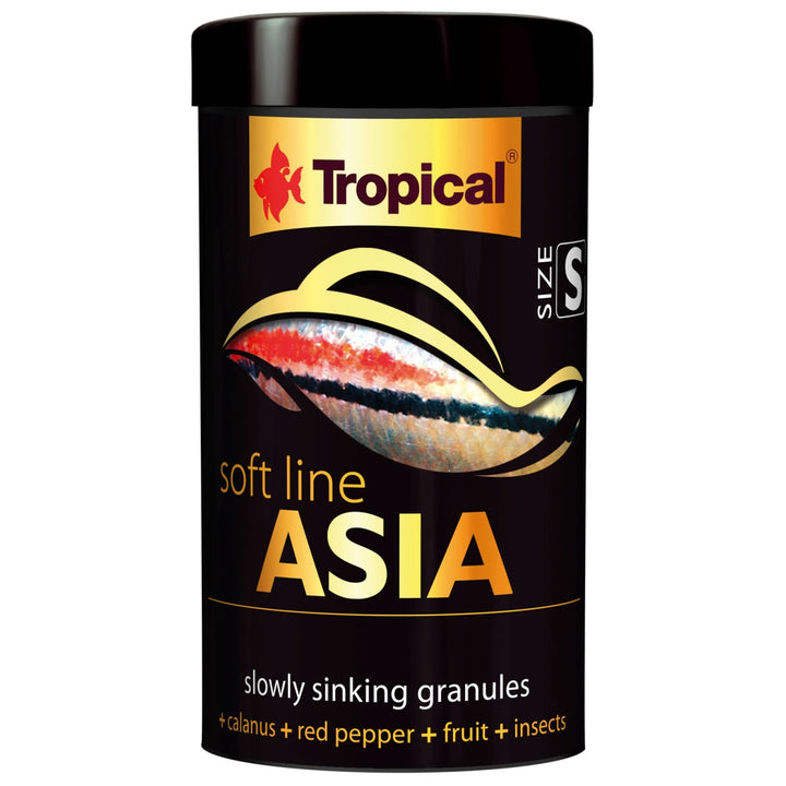 A black cylindrical container of Tropical Soft Line Asia slow sinking granules, featuring a gold and red fish logo and a graphic of a bait on a white background.