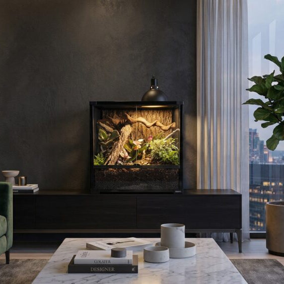 White Python Nightforge Heat Lamp Reflector on a terrarium in a room